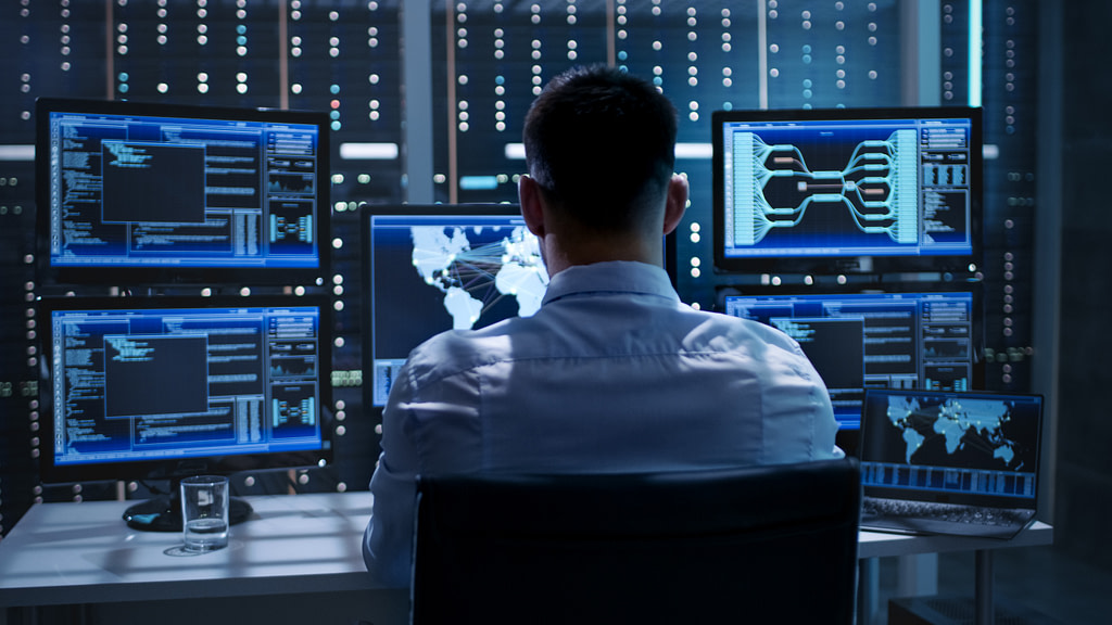 A man conducts a cybersecurity risk assessment.